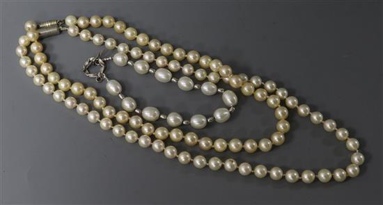 Two single strand cultured pearl necklaces and a silver and cultured pearl bracelet.
